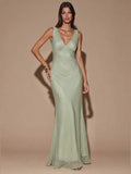 Front view of ivory sleeveless deep V-neck maxi dress with crossed open back, shown for wedding and evening wear
