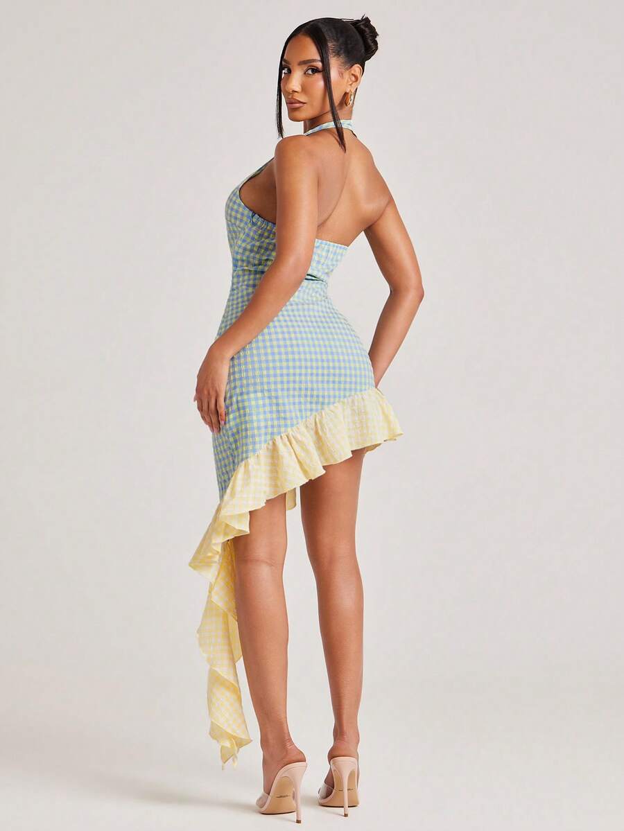 Back view of blue and yellow gingham halter bodycon mini dress with open back and cascading ruffle tail