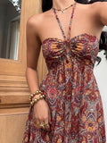 Close view rust red paisley halter maxi dress with front keyhole cutout