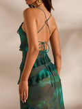 4 media show green teal abstract floral mesh maxi dress with spaghetti straps, crisscross open back, back tie, sheer overlay, ruffle trim across bust waist hips and skirt, bodycon mermaid shape. image 3