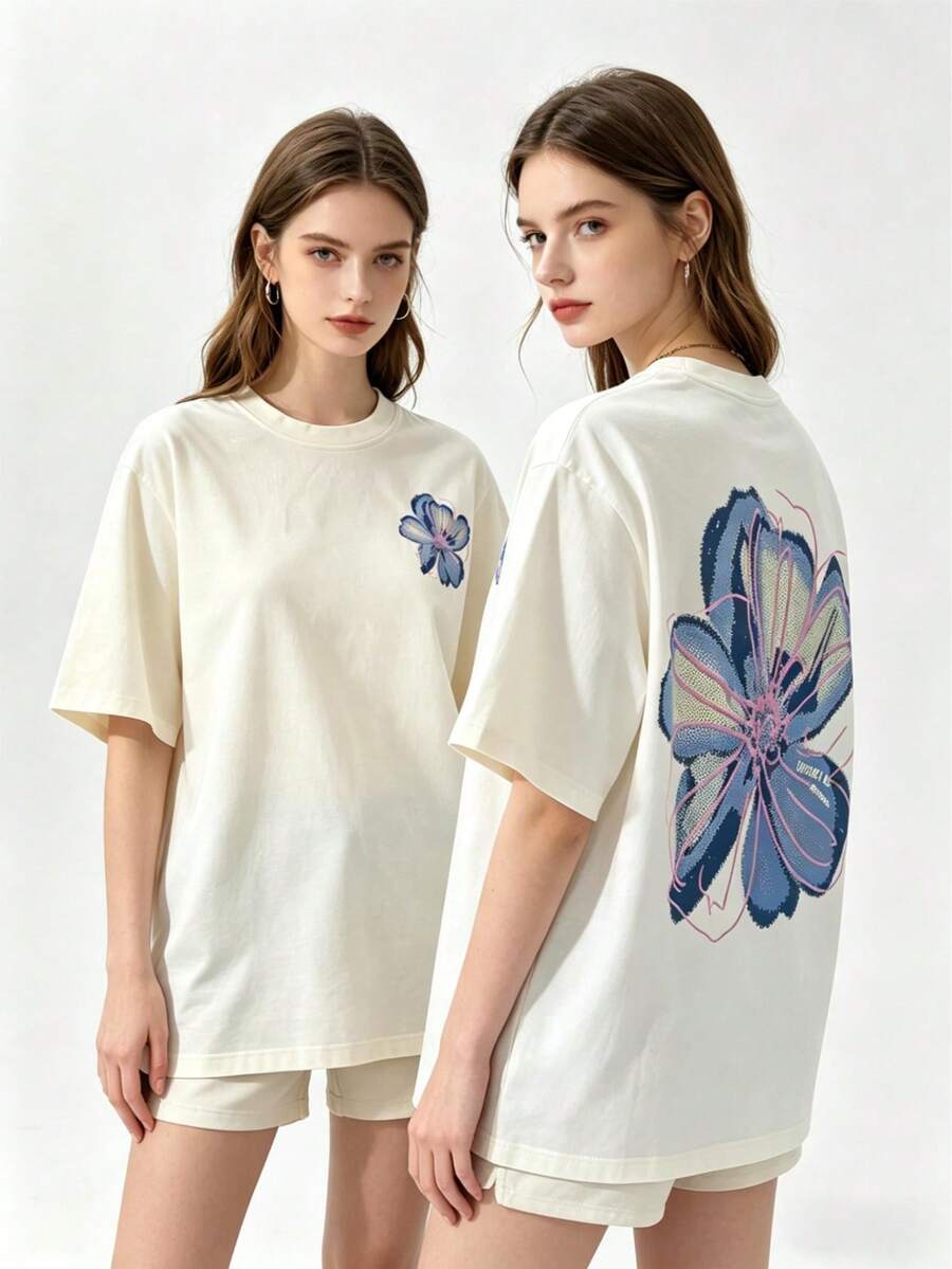 Back flat view of cream oversized floral graphic cotton tee with blue pink flower print and front inset
