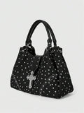Full view of red patterned hobo shoulder bag with silver cross hardware