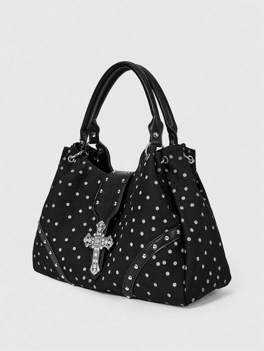 Full view of red patterned hobo shoulder bag with silver cross hardware
