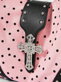 Close-up view of patterned shoulder bag hardware and handle construction