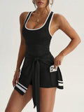 black and white racerback tennis mini dress with wrap skirt side slit and pocket shorts image 3
