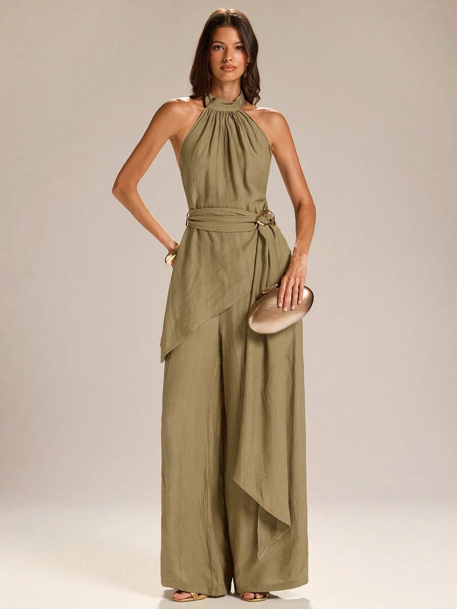 Embrace effortless summer elegance with this Women's Halter Asymmetric Hem Top &amp; Wide Leg Pants Set, designed for women who love chic style with a comfortable fit. Featuring a trendy halter neckline, stylish asymmetric hem top, and flowy wide-leg pants, this matching set creates a sophisticated silhouette perfect for warm-weather occasions.