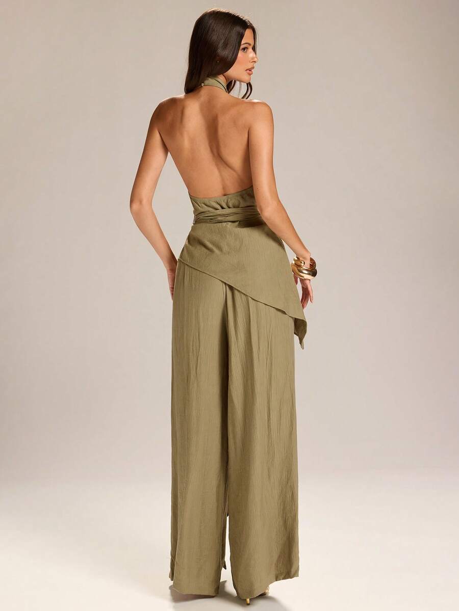 Embrace effortless summer elegance with this Women's Halter Asymmetric Hem Top &amp; Wide Leg Pants Set, designed for women who love chic style with a comfortable fit. Featuring a trendy halter neckline, stylish asymmetric hem top, and flowy wide-leg pants, this matching set creates a sophisticated silhouette perfect for warm-weather occasions.