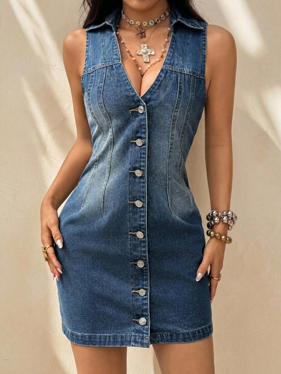 Front studio view of medium-wash sleeveless denim shirt dress with fitted shape