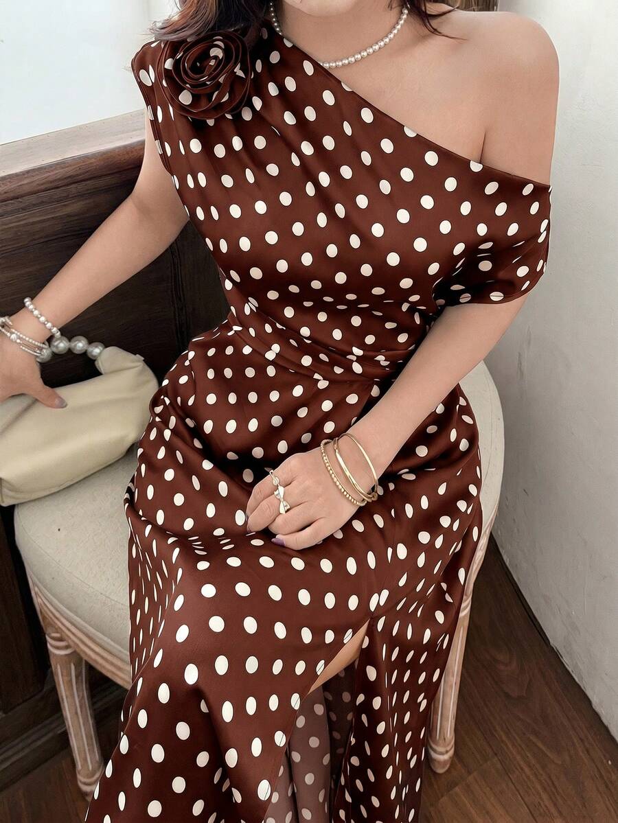 Seated close-up of coffee brown polka dot dress and floral shoulder