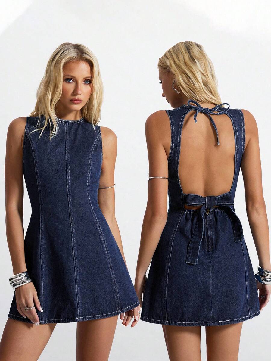 Front and back studio view of dark indigo denim mini dress with neck tie and lower back zipper