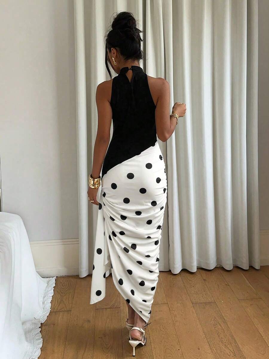 Black and white polka dot halter neck bodycon midi dress with asymmetric hem