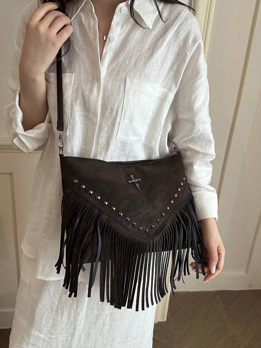 Image 1 - front view of Chic Vintage Leather Crossbody Bag with Boho Style and Decorative Tassels for Everyday Travel