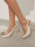 Ivory peep-toe clear PVC slingback stilettos on feet