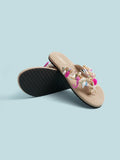 Product and outsole view of embellished thong sandals with marine-themed charms