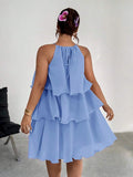 Back view of periwinkle blue halter dress with tie detail
