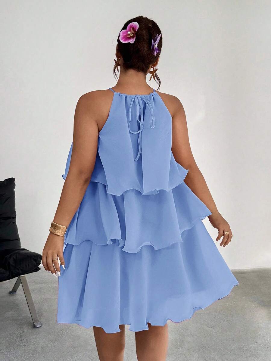 Back view of periwinkle blue halter dress with tie detail