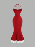 Back view of red halter mermaid midi dress with white ruffle hem