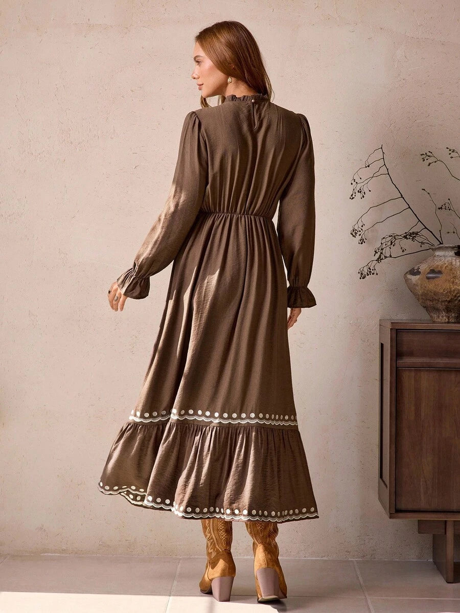 Front view of vintage bohemian brown maxi dress with frill trim and embroidered hem for autumn/winter with maxi dress silhouette for daily wear