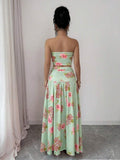 Back view of floral strapless crop top and maxi skirt set showing visible color, print, and silhouette
