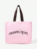 Canvas tote bag showing inner zip pocket and snap closure