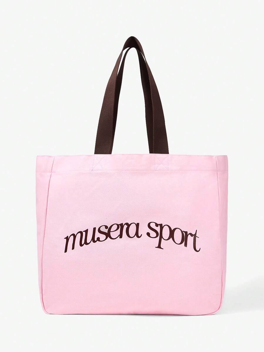 Canvas tote bag showing inner zip pocket and snap closure