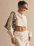 Brown cream polka dot satin shoulder bag with soft triangular body