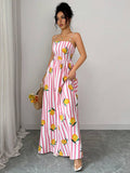 Close-up of spaghetti strap detail on lemon print dress