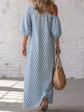 Back view of blue striped maxi dress with exposed shoulder and loose long shape