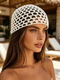 Cream crochet mesh beanie hat with rounded skullcap shape