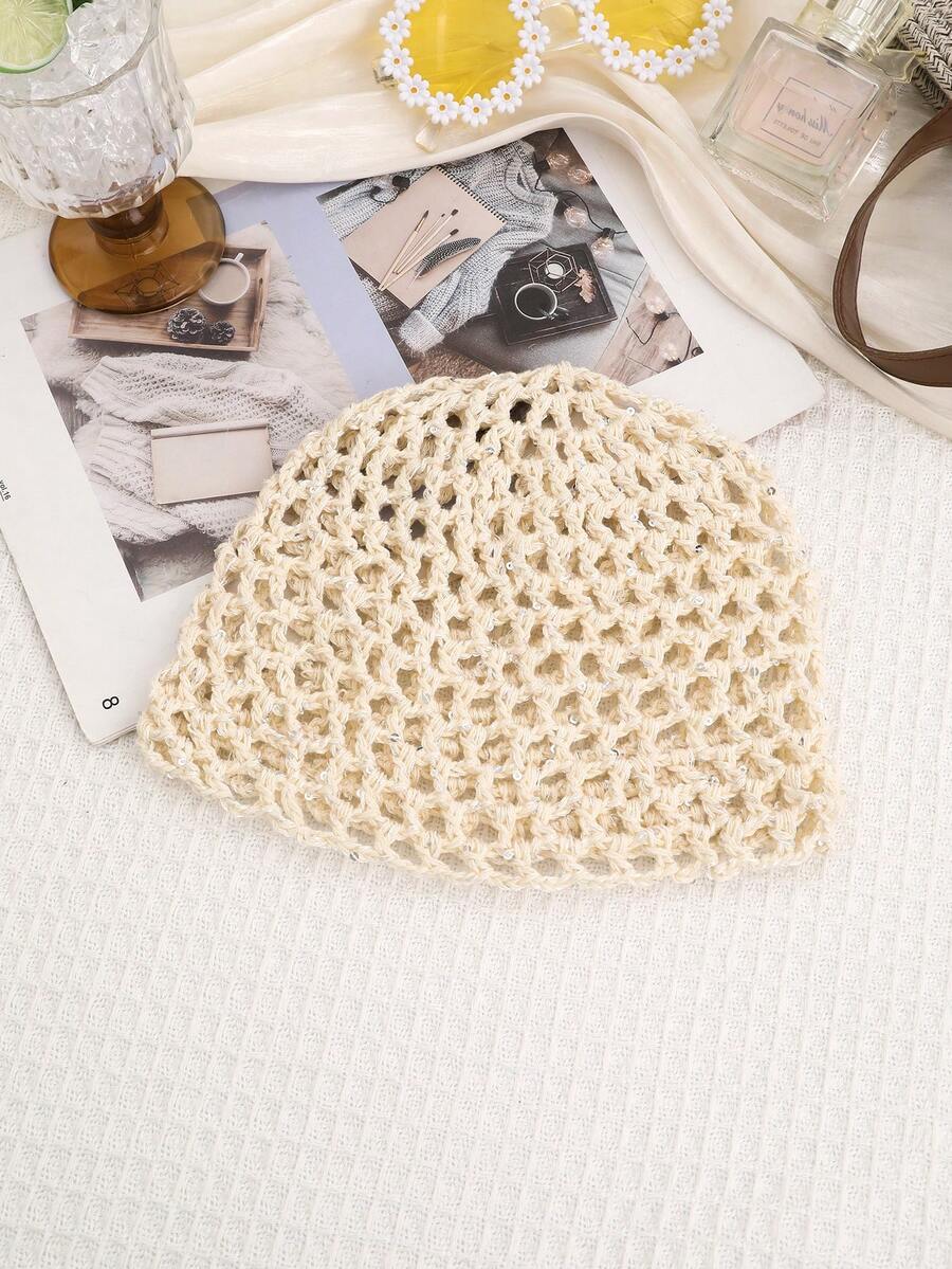 Close view of hollow out crochet cap with tiny shiny accents