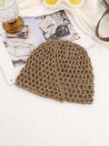 Side view of sequin openwork crochet beanie in beach resort styling