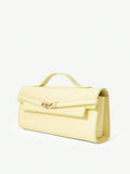 Pale yellow structured clutch bag front view with top handle and flap