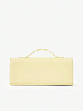 Light yellow mini bag showing rounded side gusset and arched top handle