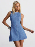 Angled front view of medium-wash denim mini dress showing curved princess seam construction