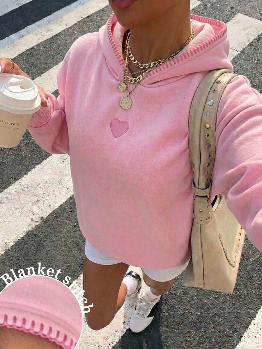 Add a playful touch to your wardrobe with this Pink Knit Hoodie Sweatshirt for Women, featuring a charming heart patch and trendy Y2K-inspired design. Crafted from soft knit fabric, this cozy pullover offers lightweight warmth and lasting comfort for everyday wear. The relaxed fit and attached hood create an effortlessly stylish look that's perfect for pairing with jeans, leggings, cargo pants, or skirts.