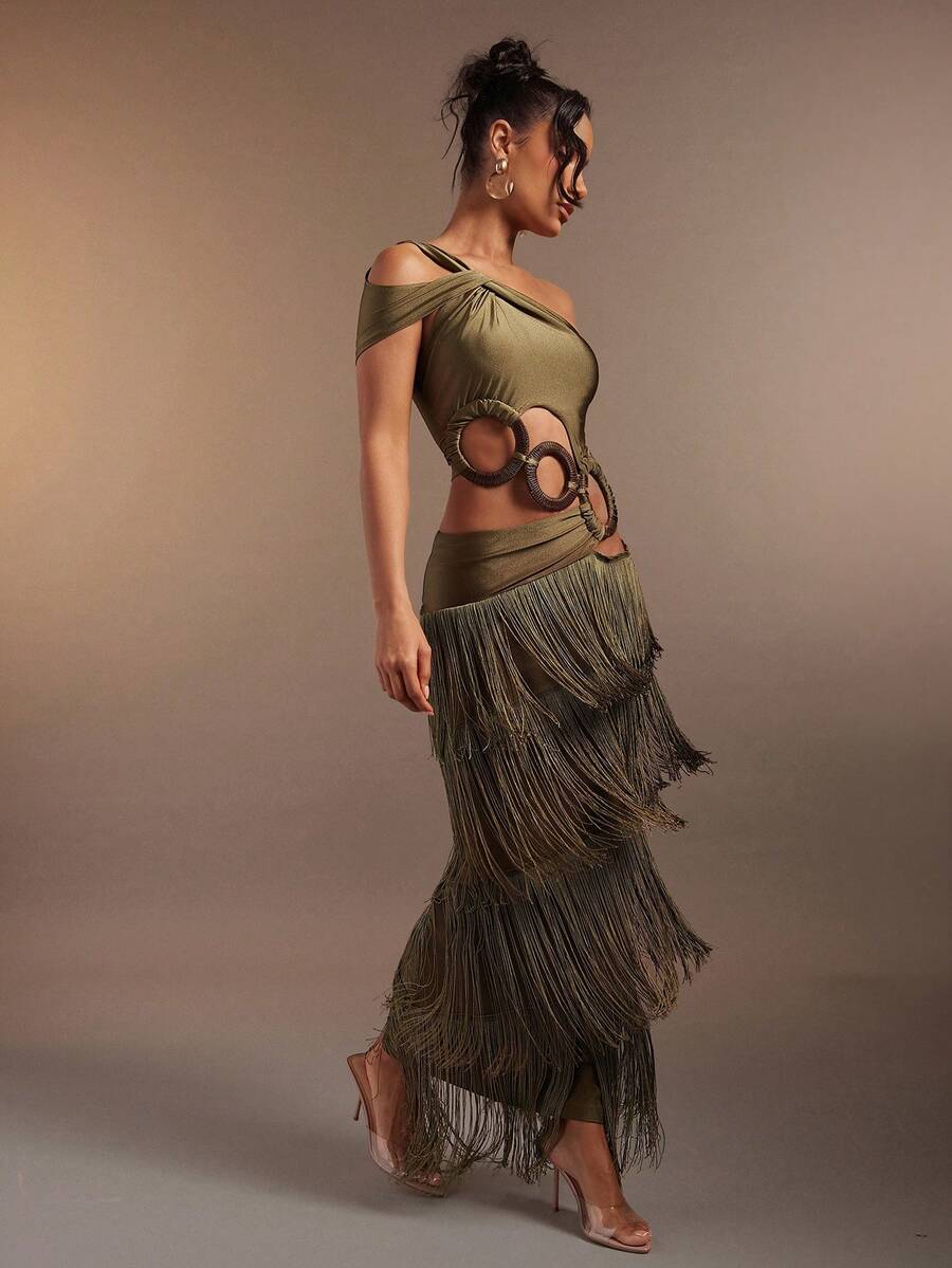 Seated view of floral woven jumpsuit with wide straps and cropped legs