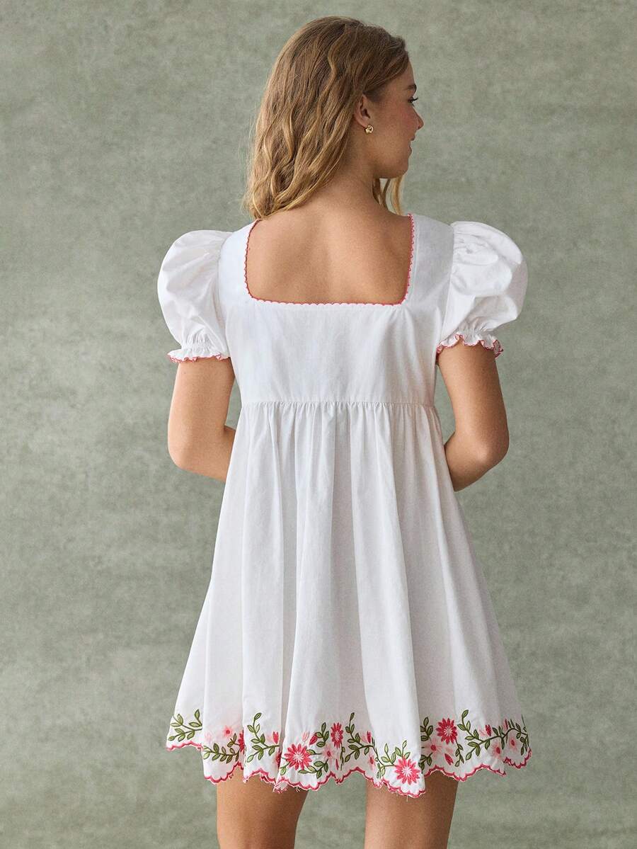 White floral embroidered babydoll mini dress with puff sleeves