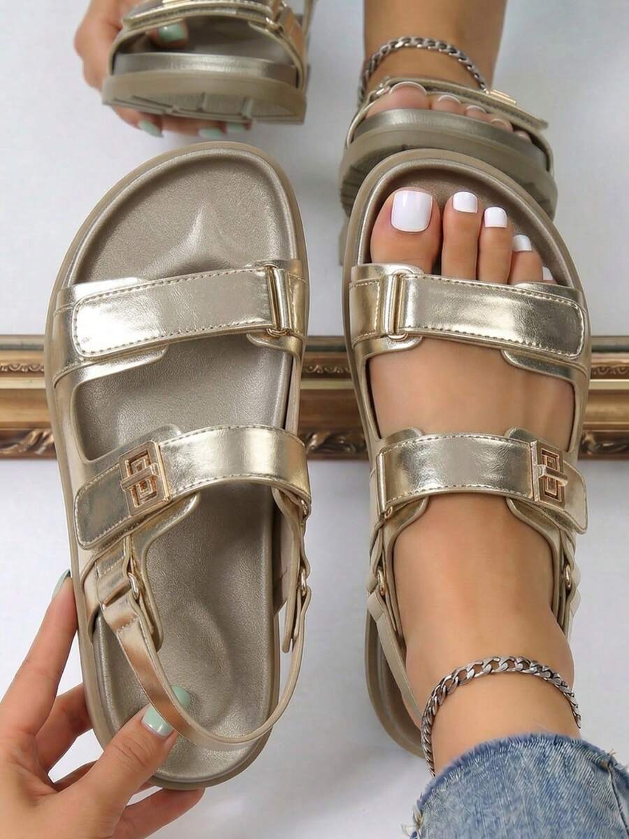 Overhead view of metallic champagne platform sandals with adjustable heel straps