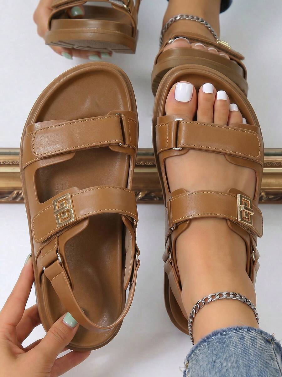 Overhead view of tan adjustable platform sandals with broad straps and heel support