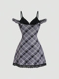 Back view of plaid mini dress with black lace panel and ruffle trim