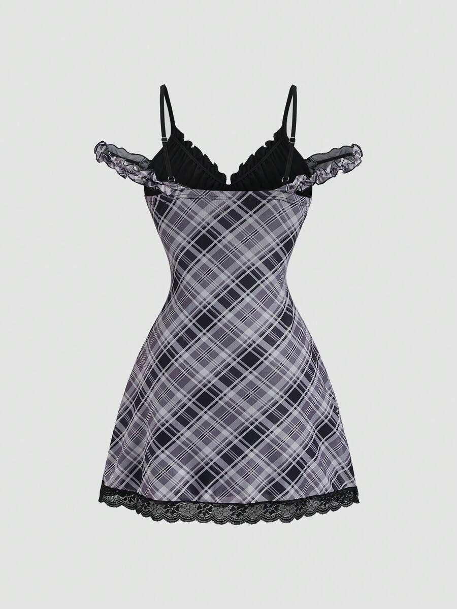 Back view of plaid mini dress with black lace panel and ruffle trim