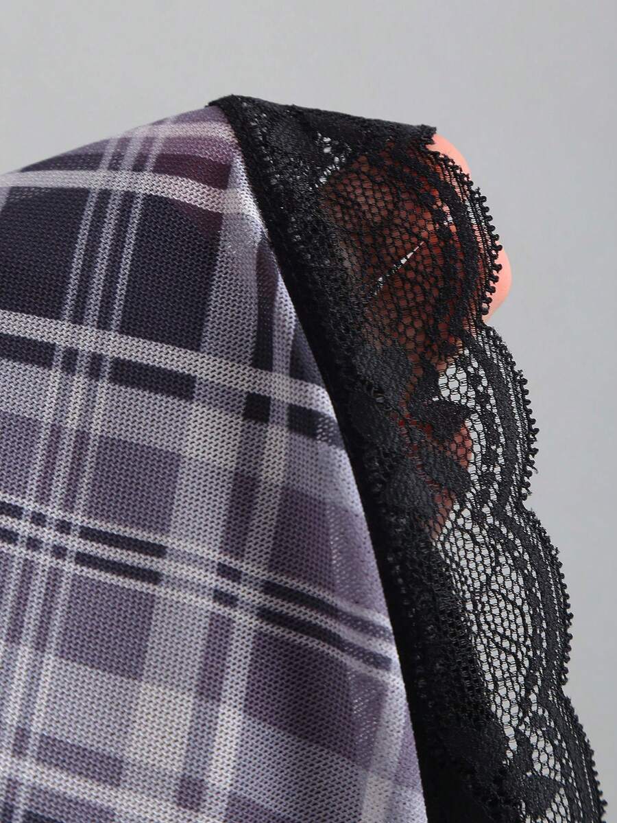 Close-up of plaid mesh and black lace patchwork detail