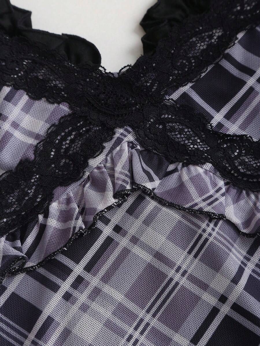 Close-up of layered black lace neckline and plaid frill trim