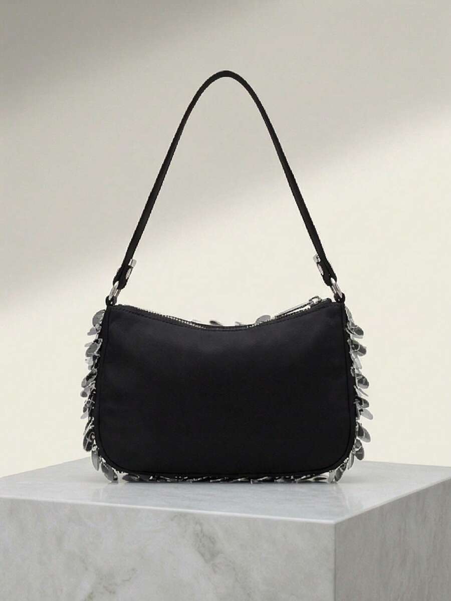 Back view of black sequin shoulder bag showing plain black panel