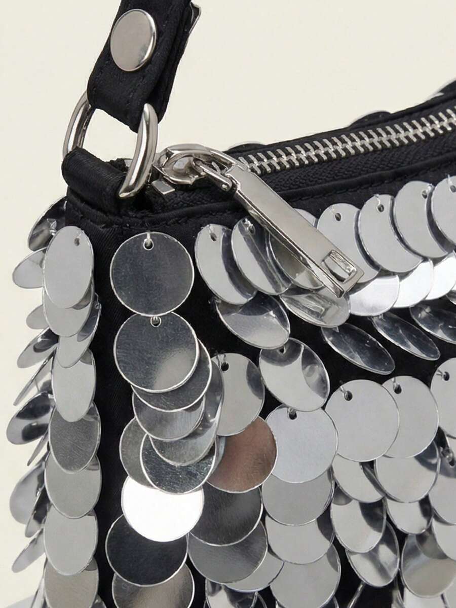 Lifestyle view of compact silver sequin baguette shoulder bag