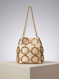 Tortoiseshell acrylic ring bucket bag with cream satin pouch and gold links