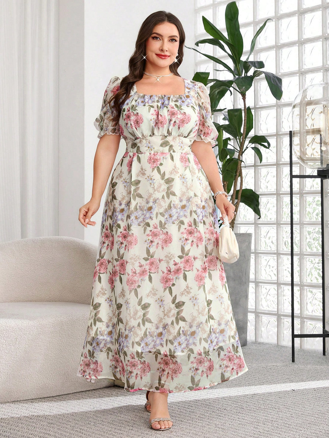A woman models a light pink lace midi dress with puff sleeves, a square neckline, and a flared skirt in a bright room with a large mirror and window.