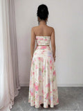 Styled view of floral strapless crop top and maxi skirt set showing visible color, print, and silhouette