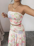 Styled view of floral strapless crop top and maxi skirt set showing visible color, print, and silhouette