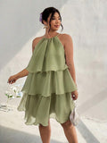 Front view of sage green tiered halter dress